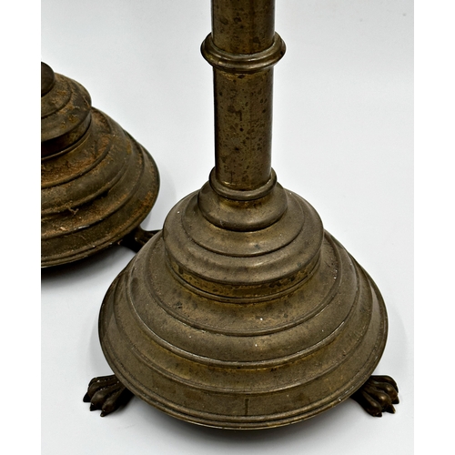 368 - Large pair of ecclesiastical brass gothic candlesticks, with raised club turrets and paw feet, 59cm ... 