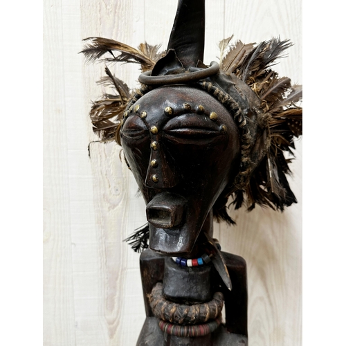 311 - Tribal Interest - Songye power figure from DR Congo, with applied horn and feather decoration, upon ... 