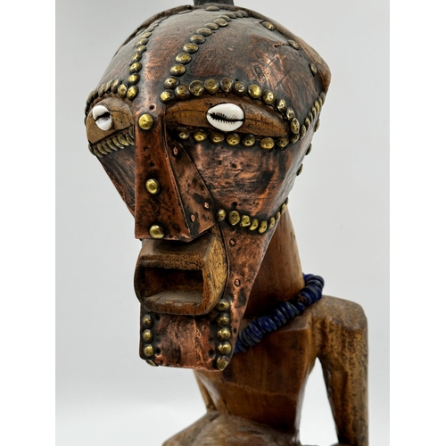 312 - Tribal Interest - Songye power figure from DR Congo, with applied horn and studded copper decoration... 