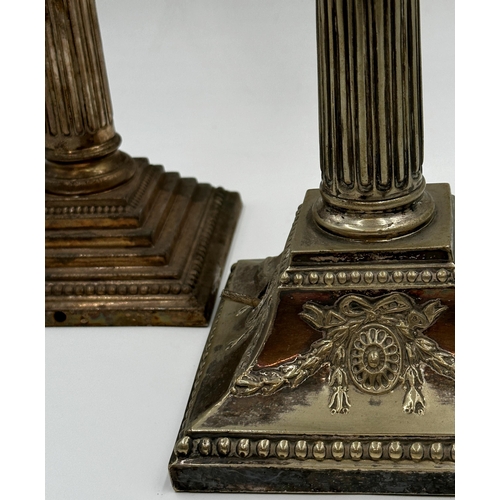 82 - Two similar silver plated Corinthian column table lamps, converted to electricity, 36cm high (2)