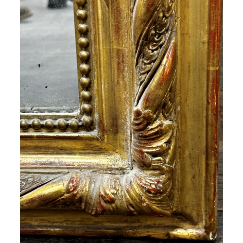 1176 - A large and impressive Florentine giltwood and gesso over mantel mirror the original glass plate fra... 