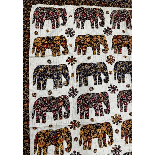 1458 - Indian patchwork cotton bedspread, with geometric elephant pattern and floral borders, 260cm x 210cm... 