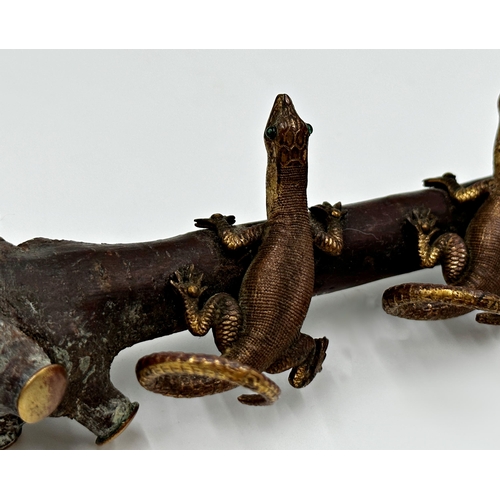 325 - Unusual possibly Japanese gilt metal character group of four lizards on a rooted branch, the branch ... 