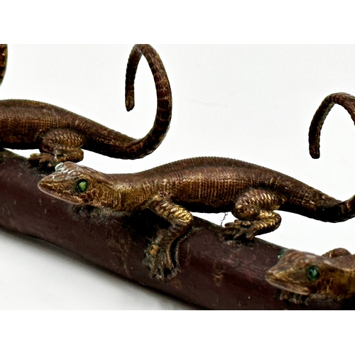 325 - Unusual possibly Japanese gilt metal character group of four lizards on a rooted branch, the branch ... 