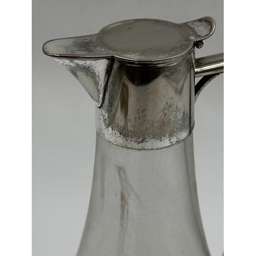 106 - Good silver plated and threadwork glass claret jug, 25cm high.