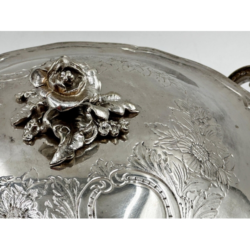 110 - Good quality nickel plated twin handled terrine the lid mounted by a cast rose, the bowl with twin h... 