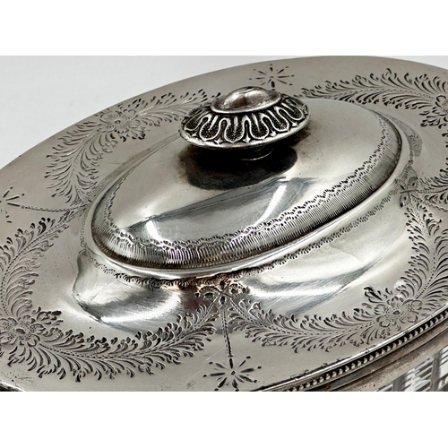 111 - Good quality silver plate and cut glass oval biscuit barrel, the hinged lid over a fluted cut glass ... 