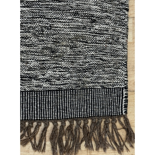 1441 - A contemporary tufted rug with stylish geometric pattern by Nkuku, cotton and wool mix
247 x 144cm