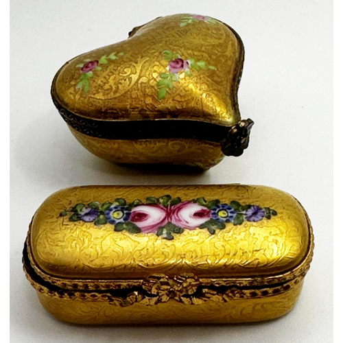 271 - Two Limoges porcelain pill boxes, of heart and oval form. with gilt floral overlay, 5 and 5.5cm long... 