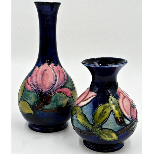 354 - William Moorcroft 'magnolia' pattern bottle neck and baluster vase, 21 and 13cm high respectively (2... 