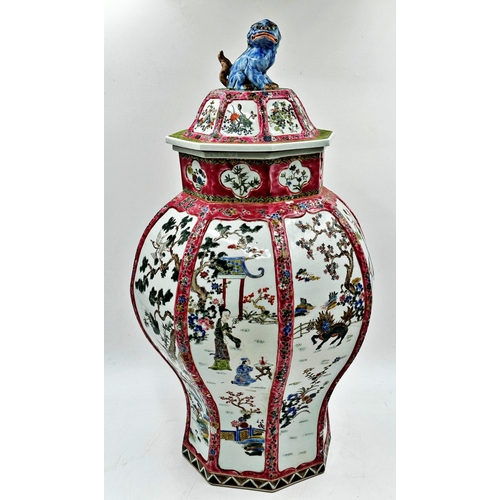 301 - Chinese porcelain famille rose faceted baluster lidded vase, mounted by a seated dog of Fo with flor... 