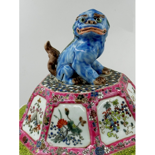 301 - Chinese porcelain famille rose faceted baluster lidded vase, mounted by a seated dog of Fo with flor... 