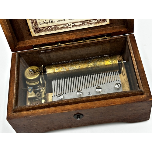 58 - Early 20th century Thorens walnut cased musical snuff box, playing six airs, 15.5cm long, currently ... 