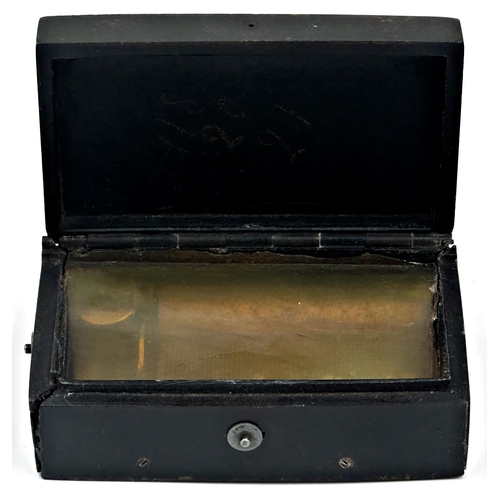 59 - 19th century Bois Durci cased musical snuff box, playing four airs, the hinged lid moulded with sunb... 