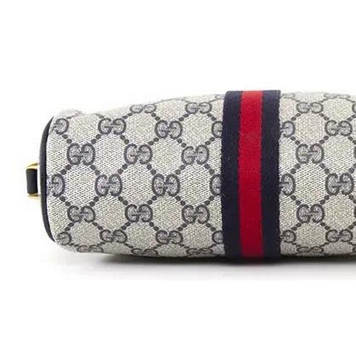 261 - A vintage Gucci monogram GG blue red stripe crossbody bag featuring signature navy Gucci GG print ca... 