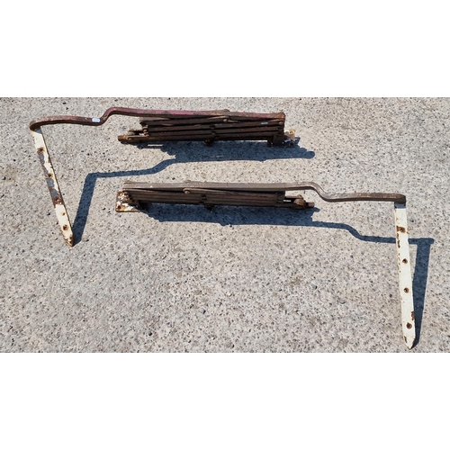 1033 - A pair of antique wall mounted cast iron telescopic sign holders (2)