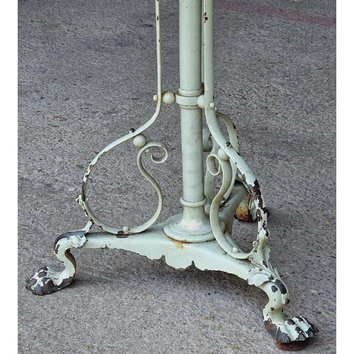 1042 - A cast iron table in the style of W.A.S Benson with scrolled  supports and lions paw feet, 73 x 61cm