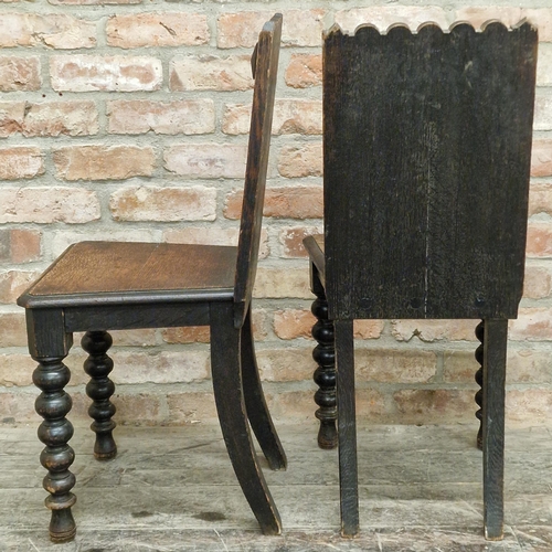 1294 - Pair of antique oak gothic hall chairs or back stools, the raised backs carved with flowerhead and o... 