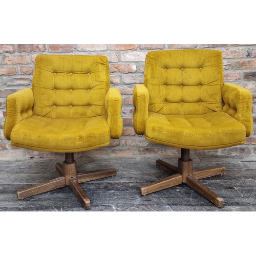 1204 - Pair of 1960s swivel lounge chairs, with buttoned upholstery and teak bases, 90cm high (2).