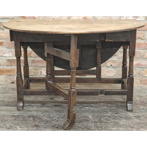 1311 - Early 18th century oak gateleg table with wavy apron fitted with a single drawer united by stretcher... 