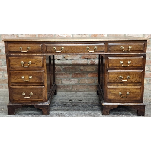 1315 - Good quality mid 20th century reclaimed oak twin pedestal desk with gilt and green leather top over ... 