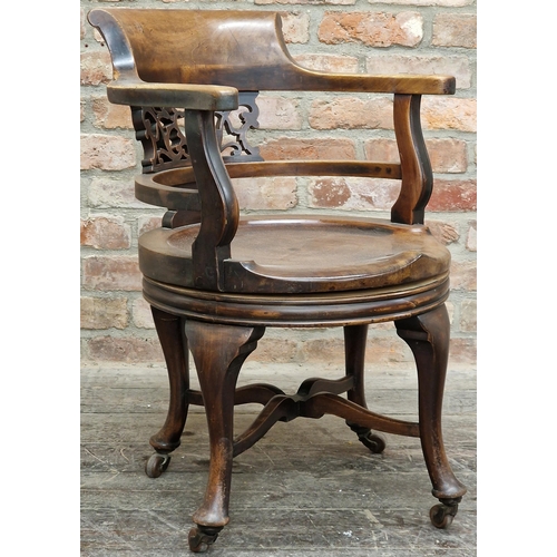 1326 - Good quality early 20th century revolving mahogany desk chair the smokers bow top rail over a pierce... 