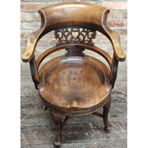 1326 - Good quality early 20th century revolving mahogany desk chair the smokers bow top rail over a pierce... 