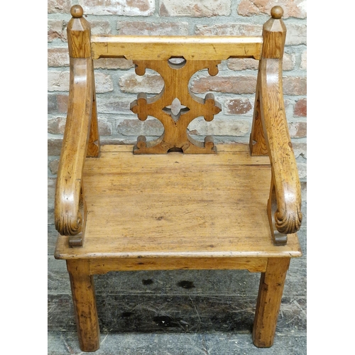 1339 - A 19th century Gothic Revival pitch pine carver hall chair