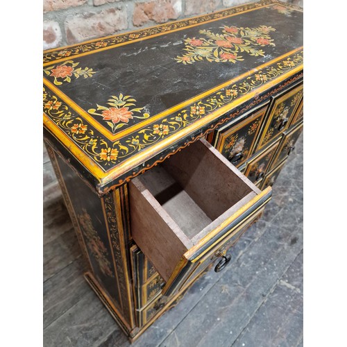 1332 - Painted Indian specimen or spice cabinet with sixteen square drawers with ring handles painted flora... 