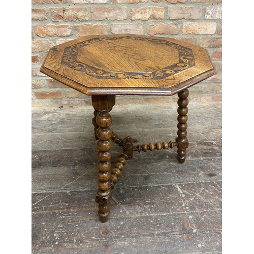 1297 - 19th century oak gypsy type table, the octagonal top carved with scrolled acanthus upon three bobbin... 