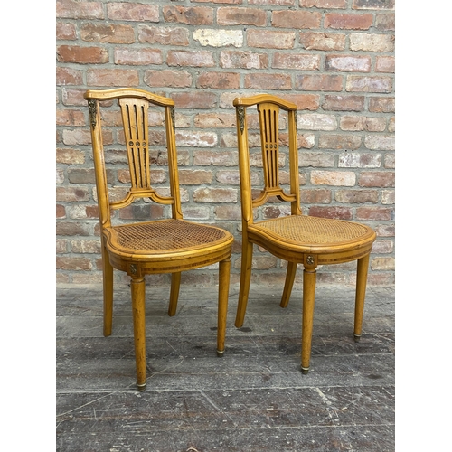 1306 - Pair of French empire satinwood side chairs with bergere seats and ormolu mounts (2).