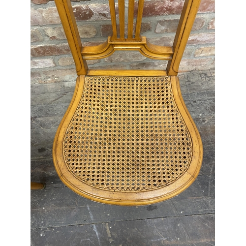 1306 - Pair of French empire satinwood side chairs with bergere seats and ormolu mounts (2).