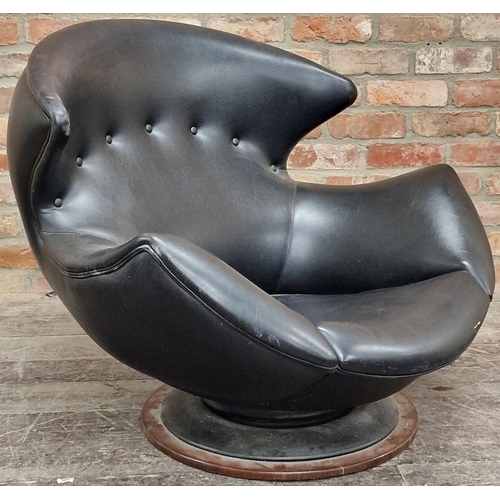 1227 - 1960s Italian swivel lounge chair in egg shape with with cow horn top button back upholstery upon an... 