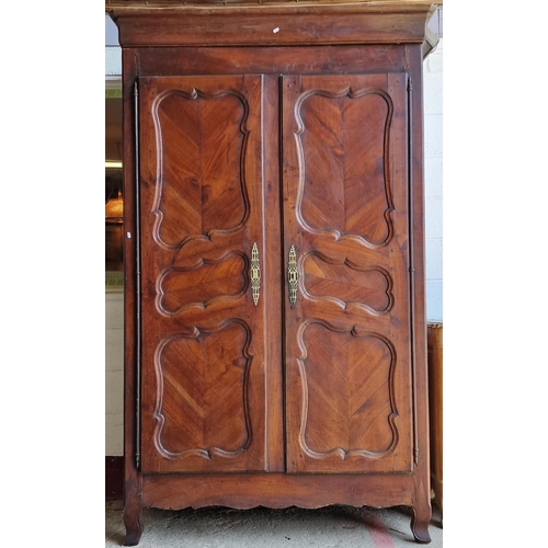 1354 - 19th century French fruitwood armoire, with scrolled panelled doors, enclosing an interior fitted wi... 