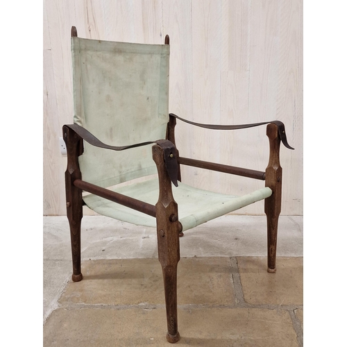 1291 - Vintage limed teak campaign safari chair leather strapwork with canvas seat and back.