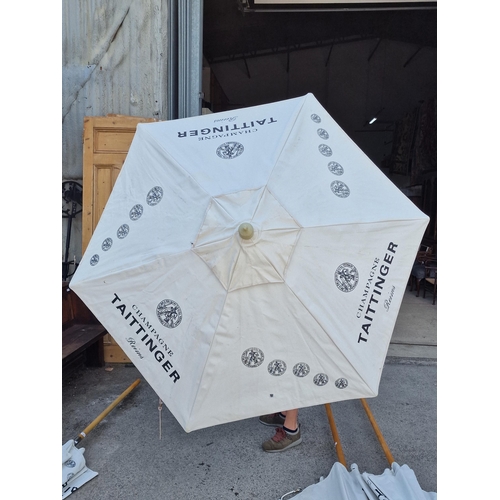 1010 - Pair of Taittinger garden parasols (2)