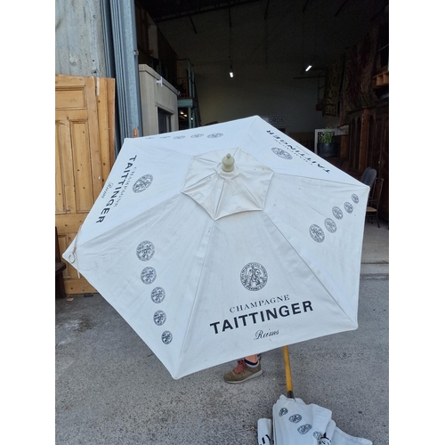 1011 - Pair of Taittinger garden parasols (2)