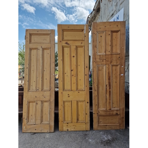 1029 - Three Victorian reclaimed pine panelled interior doors, each 241.5 x 72cm (3).