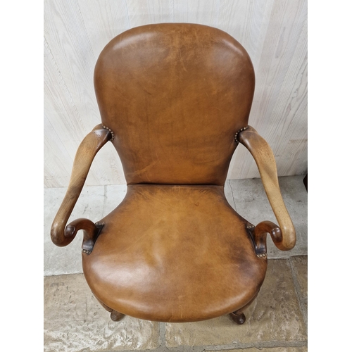 1352 - Good quality Queen Anne style hide leather armchair with scrolled arms and stylised cabriole legs.