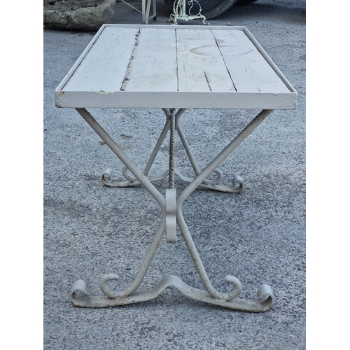 1044 - Antique cast iron table with plank top on scrolled supports and painted finish 62 x 126cm