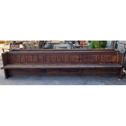 1046 - Pair of antique pitch pine church pews/settles, the panelled backs complete with book shelf, square ... 