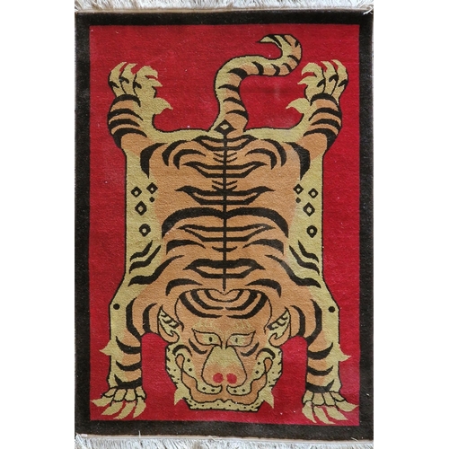 1467 - Novelty wool rug decorated with a tiger on red ground 182 x 120cm