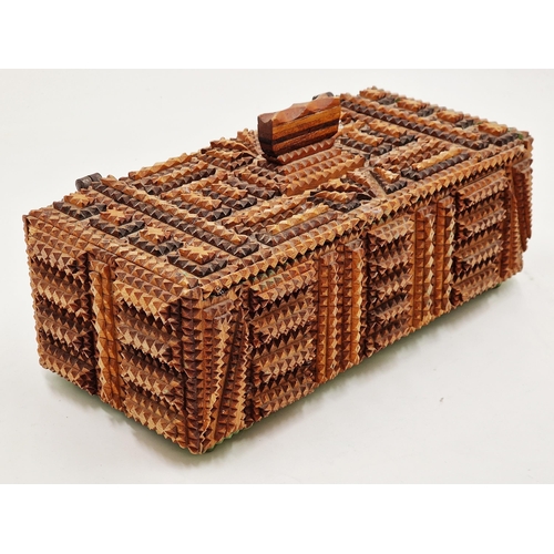 404 - Primitive tramp art box with typical carved geometric decoration, hinged lid enclosing a painted fit... 