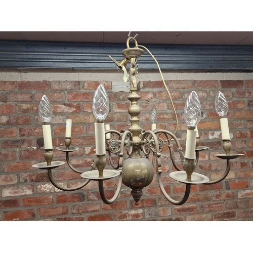 1151 - A continental brass eight branch electrolier the column with twin eagle cast decoration, 72 x 84cm