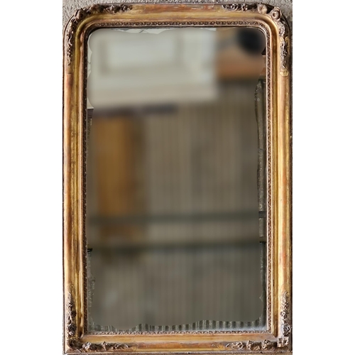 1185 - Good 19th century Florentine giltwood and gesso arched overmantle mirror, the corners with relief fl... 