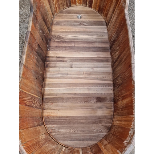 1005 - A good coopered barrel bath tub/planter with removable lid and drainage hole, 64cm high x 160cm long... 