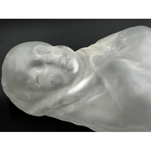 401 - An unusual early 20th Century opaque glass figure of a swaddled baby, 50cm high.