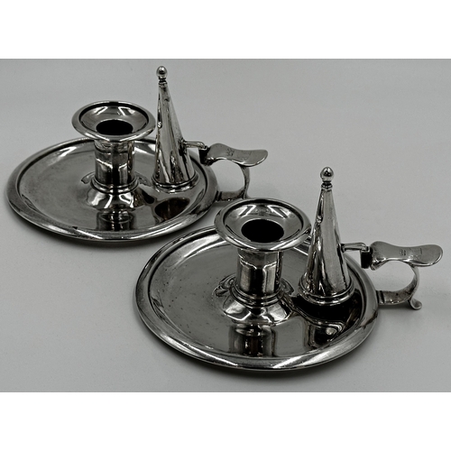 200 - Good pair of Regency silver chambersticks, with snuffers, engraved with three crests, maker Edward B... 