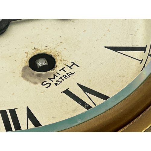 51 - A Smith Astral brass cased bulkhead clock, single train dial with subsidiary secondary dial, 17cm D