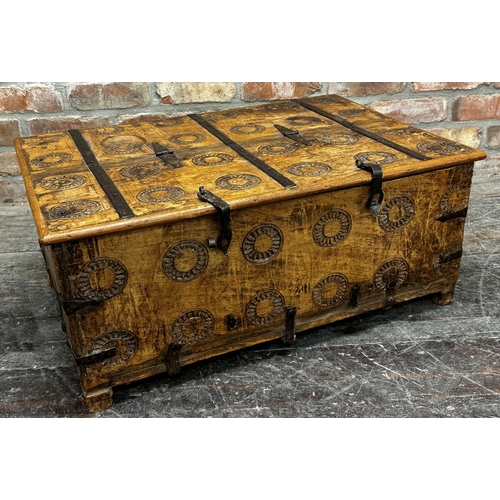 1303 - Indian hardwood and iron box with rising lid and carved medallions, 35 x 80cm